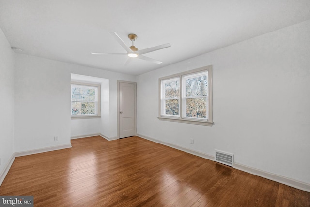 unfurnished room with wood-type flooring and ceiling fan