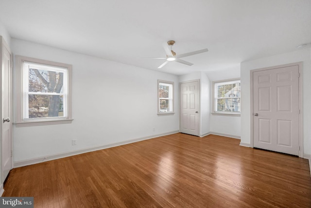 unfurnished bedroom featuring hardwood / wood-style flooring and ceiling fan