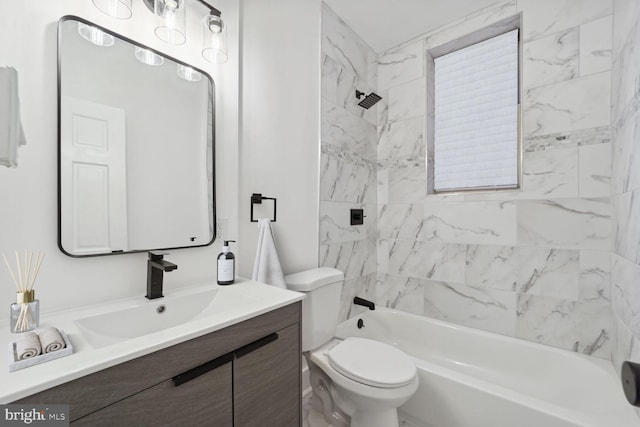 full bathroom featuring vanity, toilet, and tiled shower / bath combo