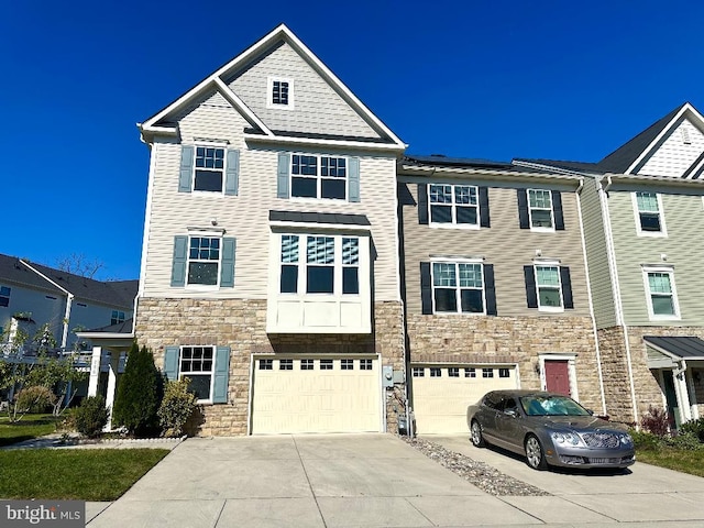 multi unit property featuring a garage