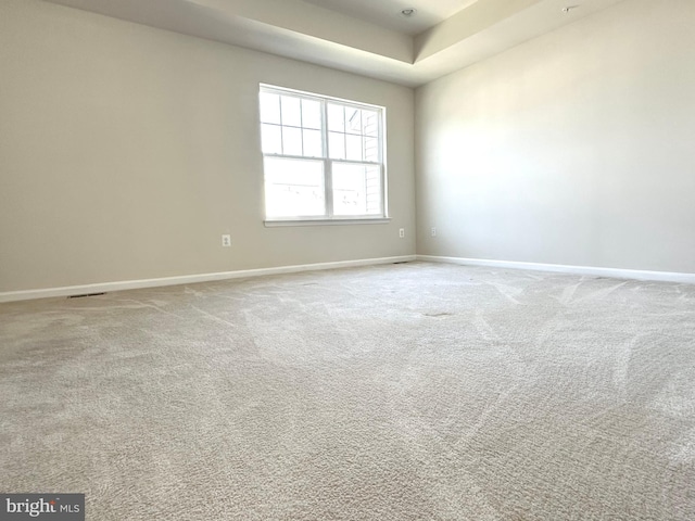 unfurnished room with light carpet