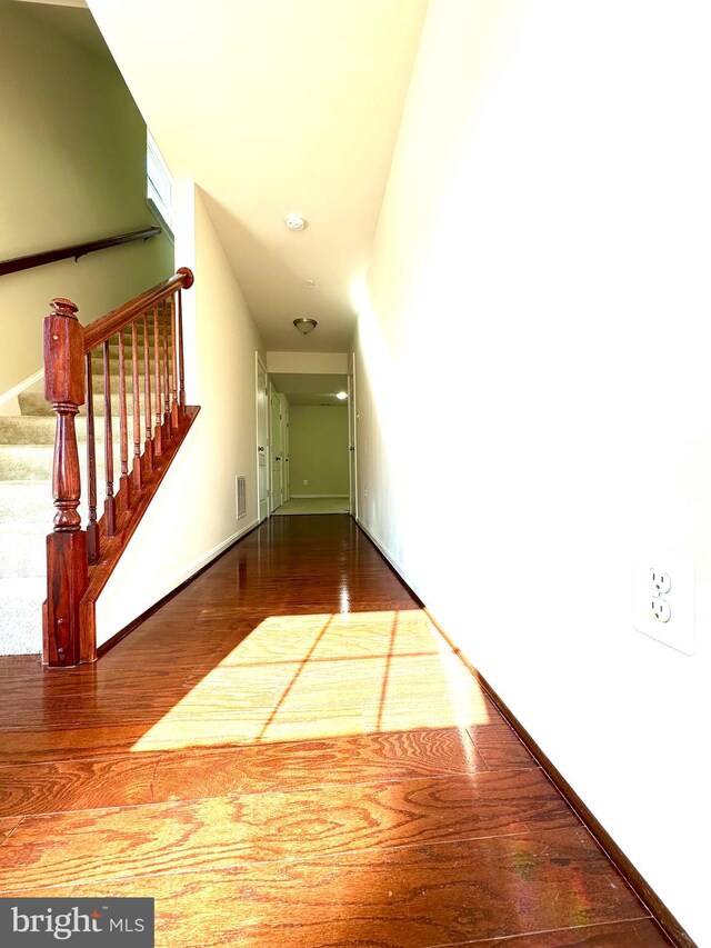 hallway featuring hardwood / wood-style flooring