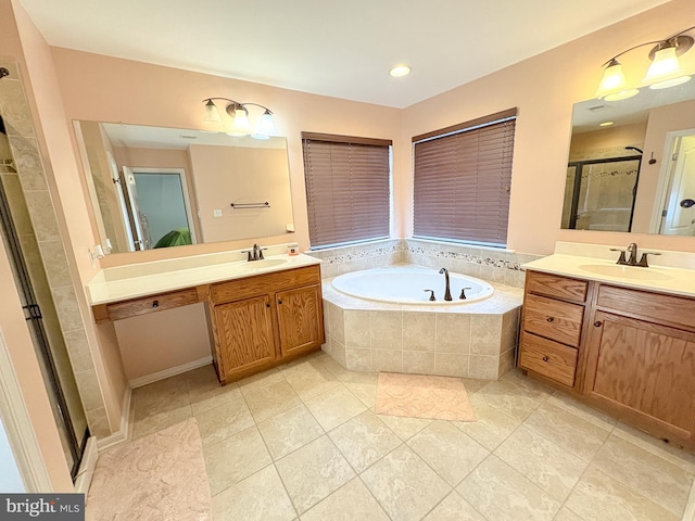 bathroom with tile patterned flooring, vanity, and independent shower and bath