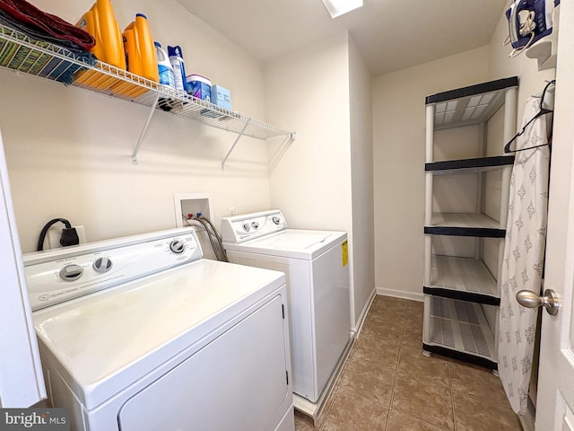 clothes washing area featuring washer and clothes dryer