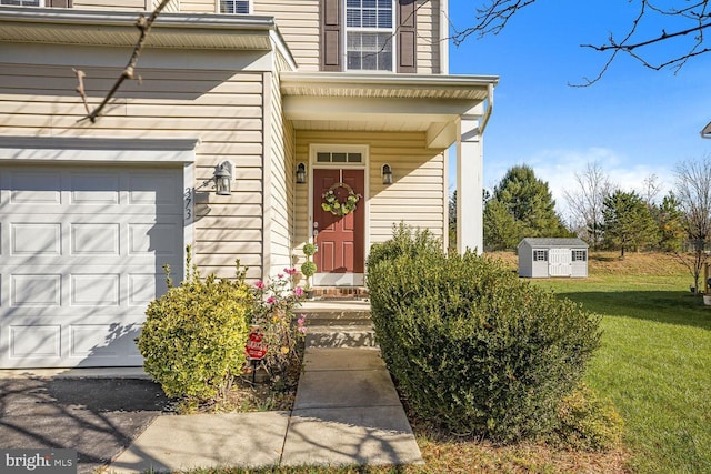 entrance to property with a yard and a garage