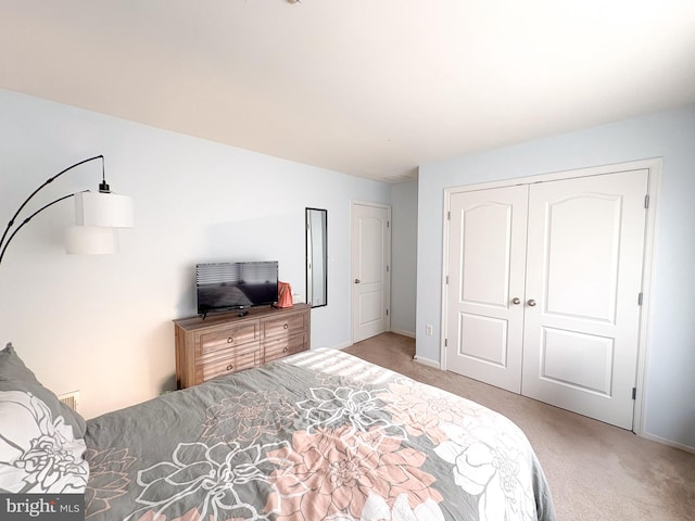 carpeted bedroom with a closet