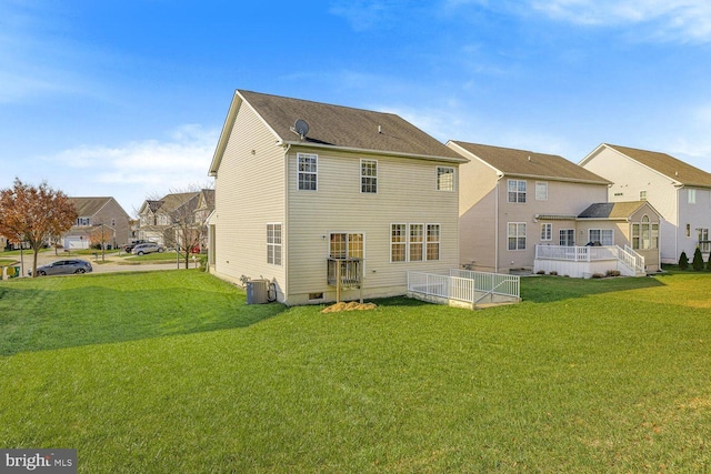 back of house featuring a yard