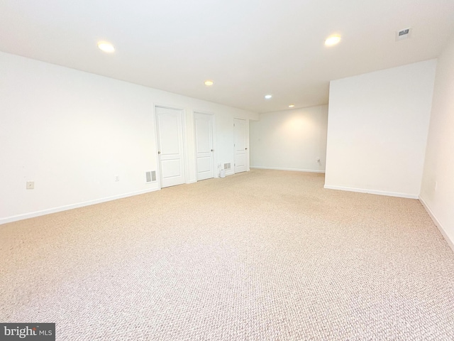 basement with light colored carpet