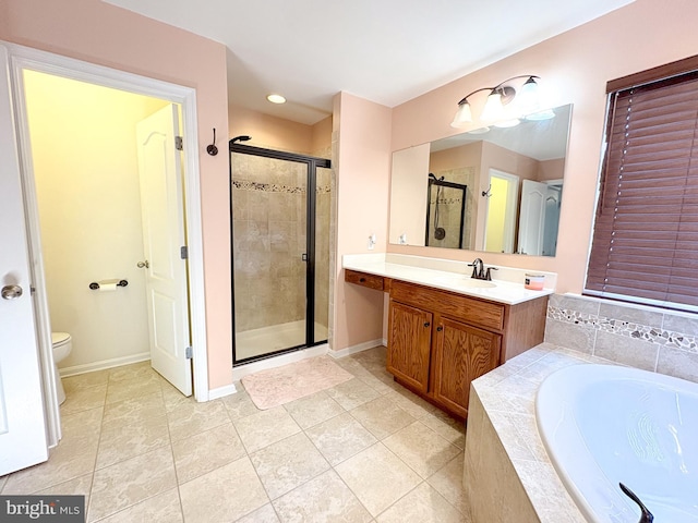 full bathroom with tile patterned flooring, vanity, toilet, and shower with separate bathtub