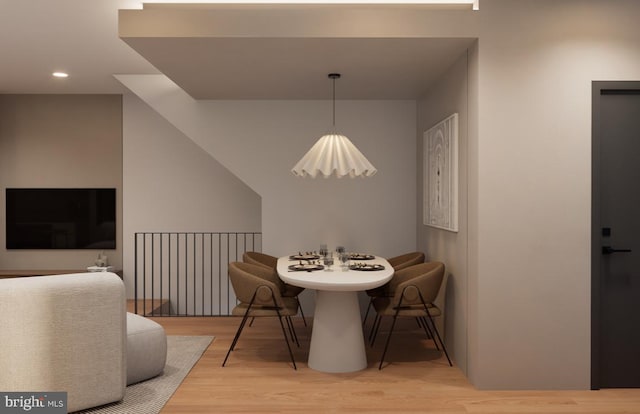 dining space with wood-type flooring