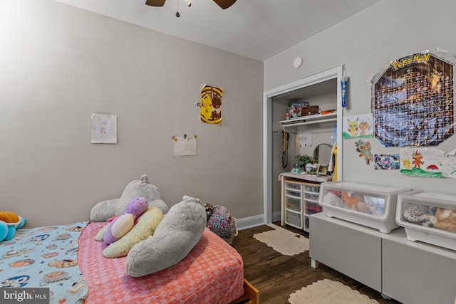 bedroom featuring a closet, dark wood-type flooring, and ceiling fan