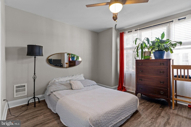 bedroom featuring dark hardwood / wood-style floors and ceiling fan