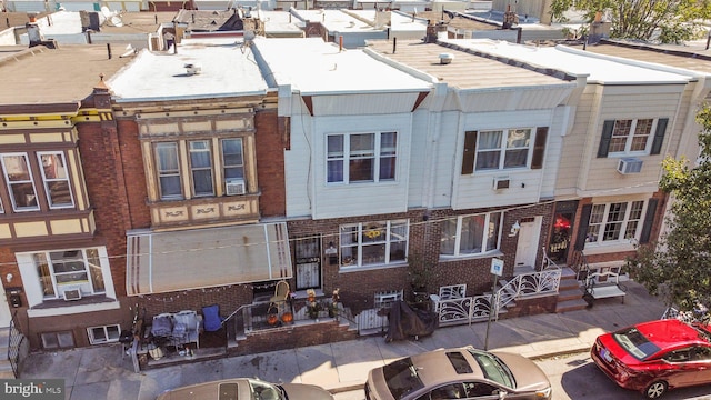 view of front facade featuring cooling unit