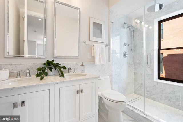 bathroom with vanity, toilet, and an enclosed shower