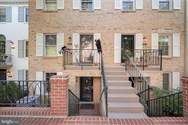 entrance to property with a balcony