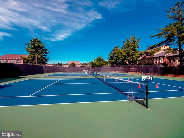 view of tennis court featuring basketball court