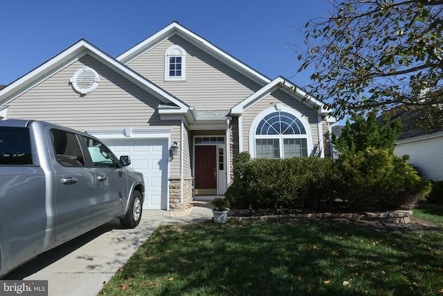 view of front facade with a front lawn and a garage