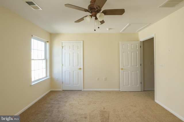 unfurnished bedroom featuring light carpet and ceiling fan