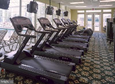 exercise room with french doors and carpet floors