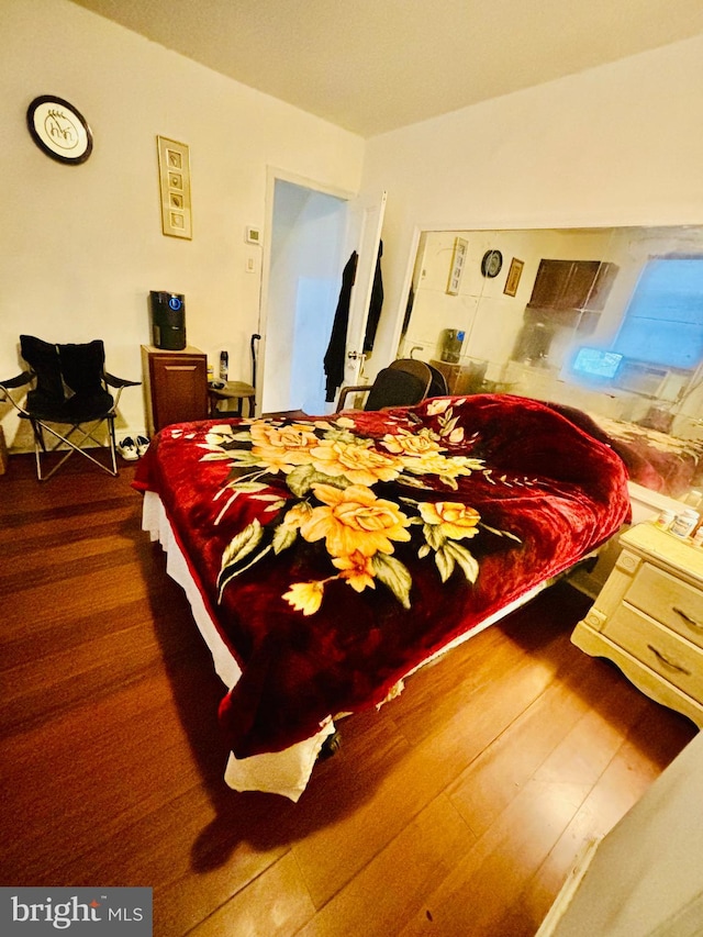 bedroom featuring dark hardwood / wood-style flooring