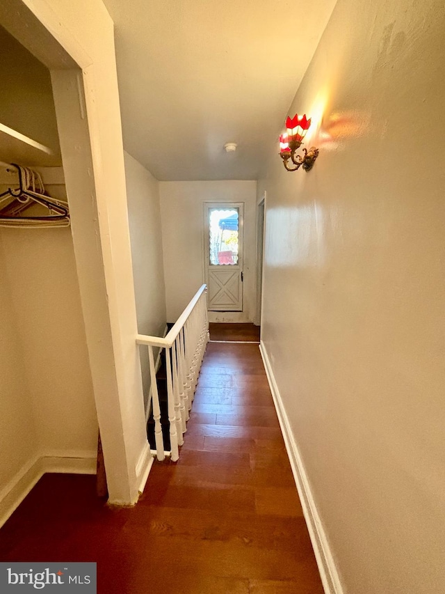 hall with dark hardwood / wood-style flooring