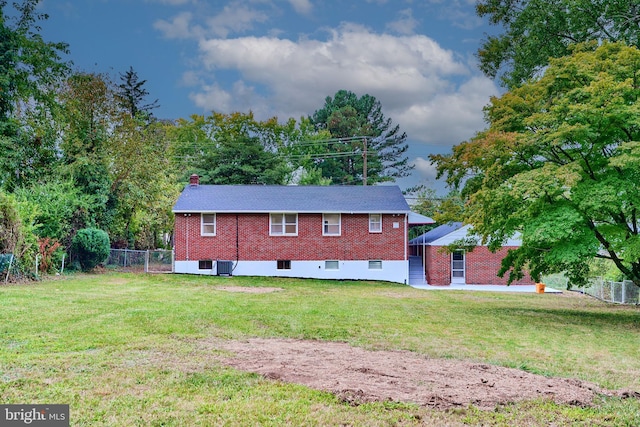 back of house with a yard