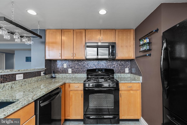 kitchen with black appliances, light stone countertops, backsplash, and recessed lighting