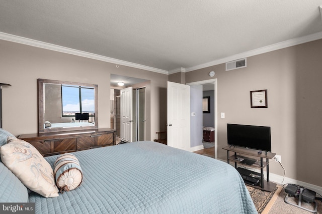 bedroom with ornamental molding and baseboards