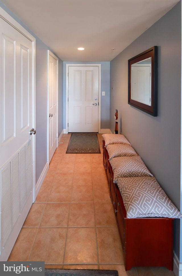 corridor featuring light tile patterned flooring