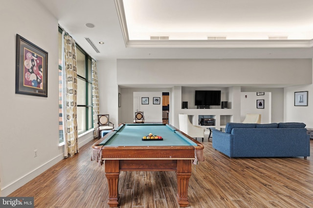 game room featuring hardwood / wood-style flooring, pool table, and a tray ceiling