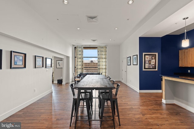 dining area with dark hardwood / wood-style floors