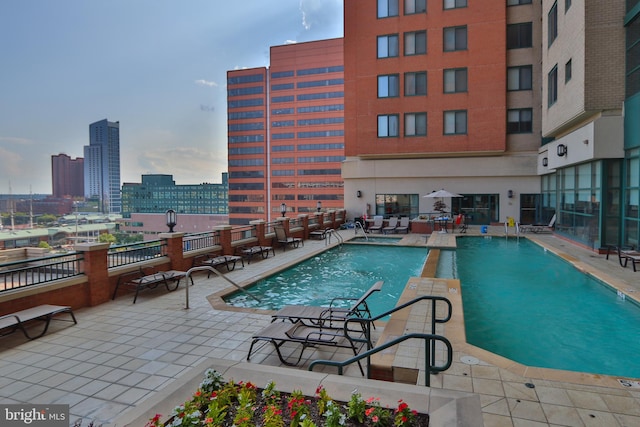 view of swimming pool featuring a patio