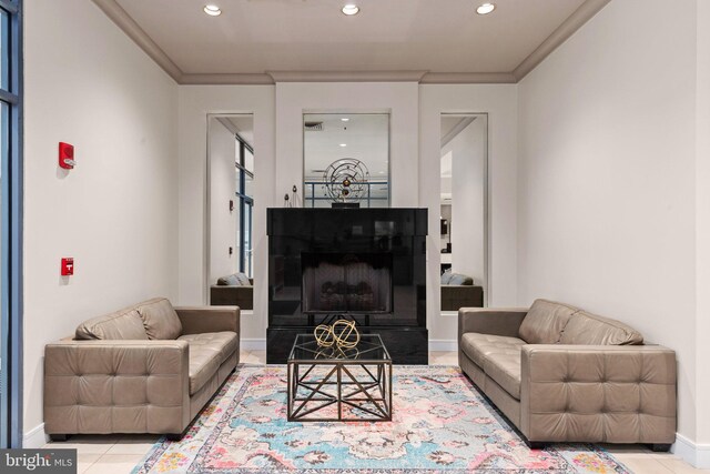 tiled living area with ornamental molding, baseboards, recessed lighting, and a fireplace