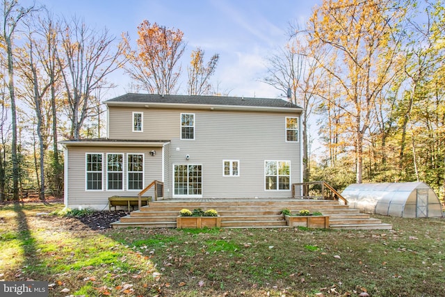 back of house featuring an outdoor structure