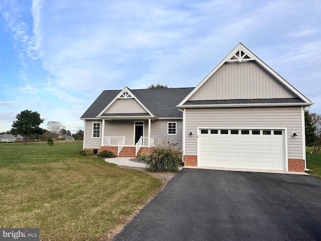 craftsman house featuring a porch, a front lawn, and a garage