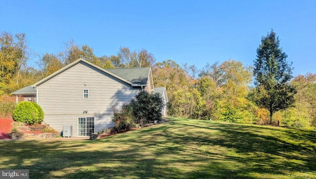 view of home's exterior featuring a yard