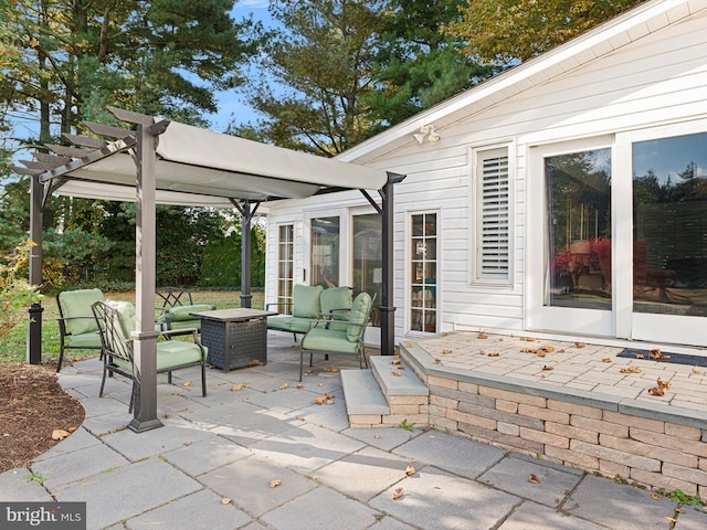 view of patio featuring a pergola and an outdoor living space