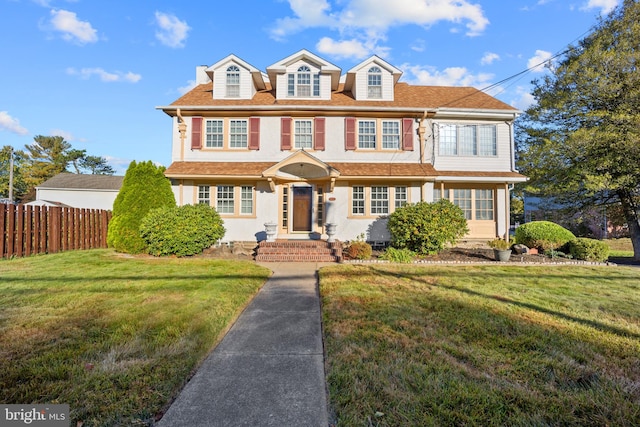 colonial inspired home with a front yard