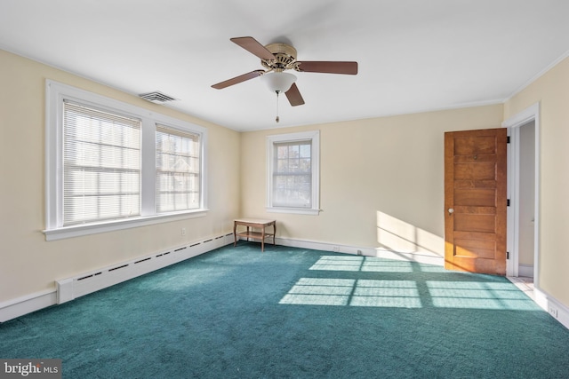 carpeted spare room featuring ceiling fan, crown molding, and a baseboard heating unit