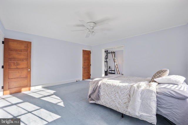 bedroom featuring a closet, ornamental molding, carpet flooring, and ceiling fan