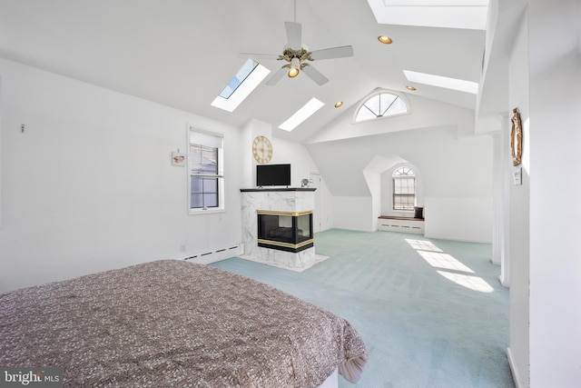 bedroom featuring a baseboard radiator, carpet, a fireplace, and ceiling fan