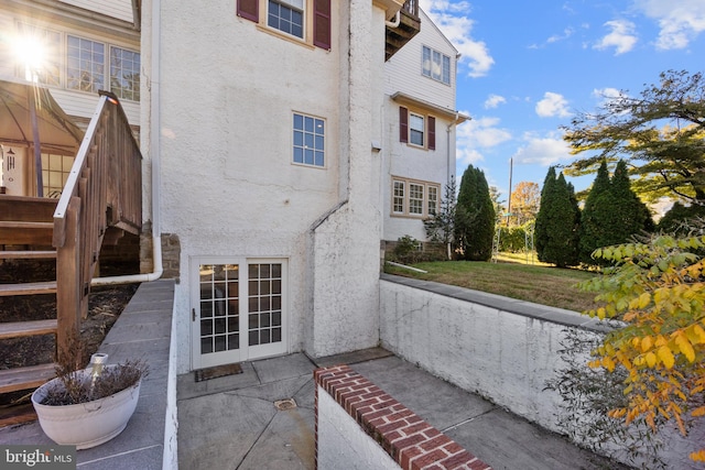 view of side of property with a patio area