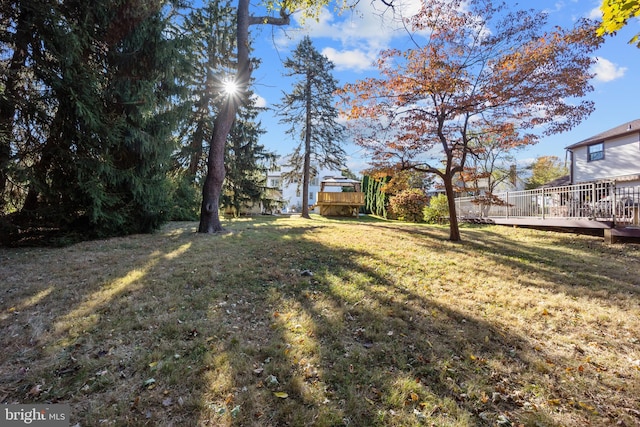 view of yard with a wooden deck