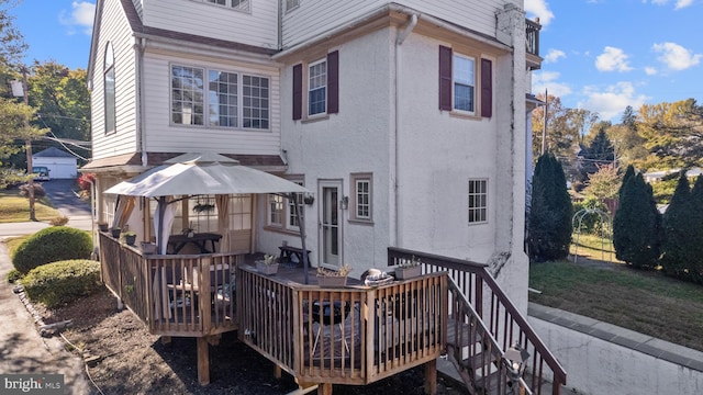 rear view of house featuring outdoor lounge area and a garage