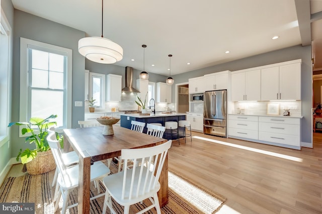 dining space featuring light hardwood / wood-style floors