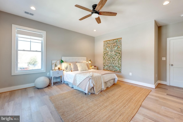 bedroom featuring ceiling fan and light hardwood / wood-style floors