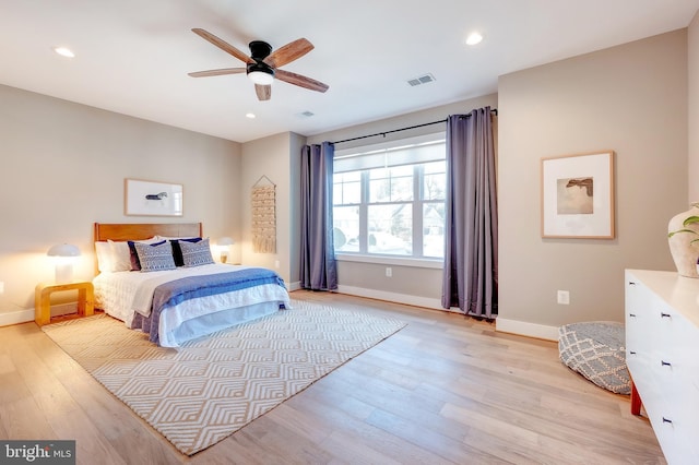 bedroom featuring ceiling fan and light hardwood / wood-style floors