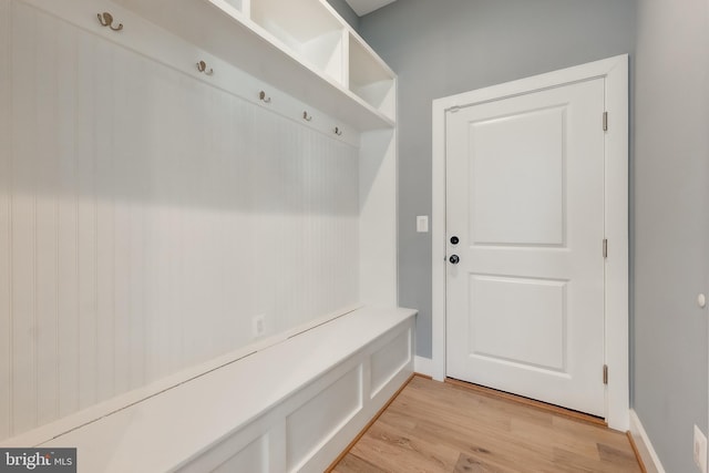 mudroom with light hardwood / wood-style flooring