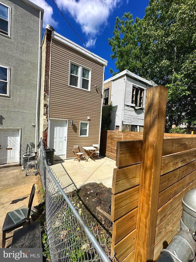 back of house with a patio area