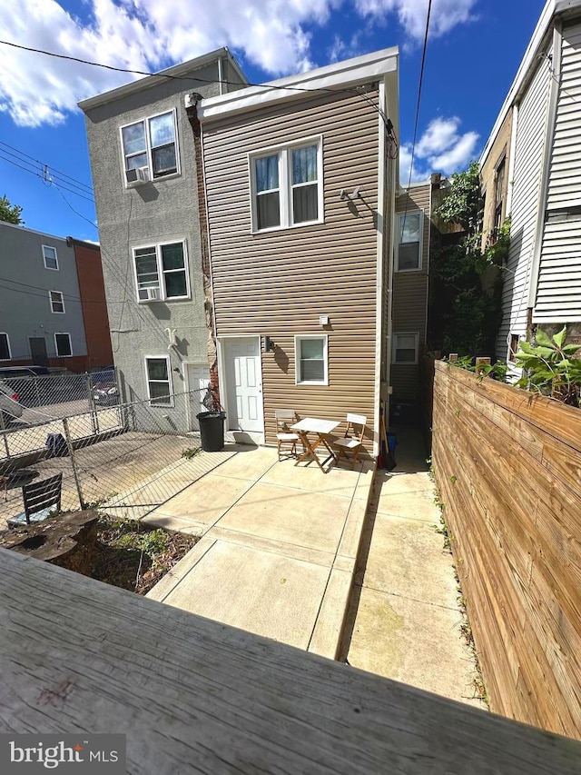 rear view of house featuring a patio